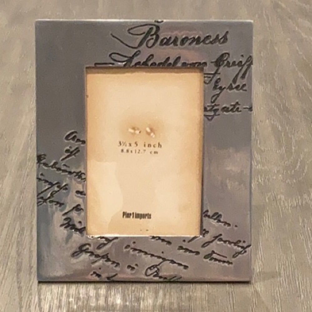 Pier 1 metal frame with cursive writing